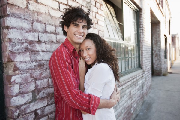 Couple hugging in urban area