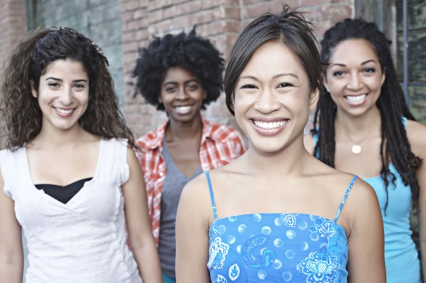 Smiling women standing together