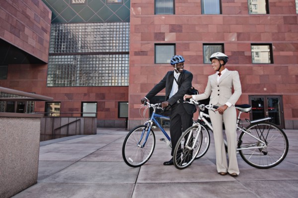 Business people in courtyard with bicycles