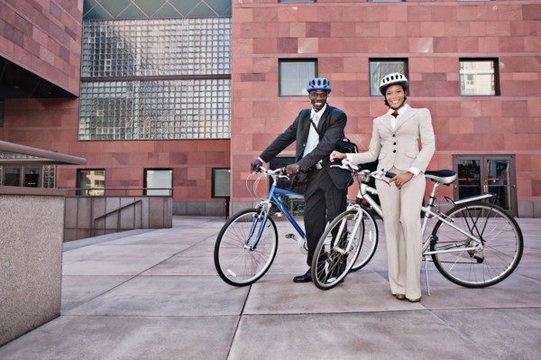 Business people in courtyard with bicycles