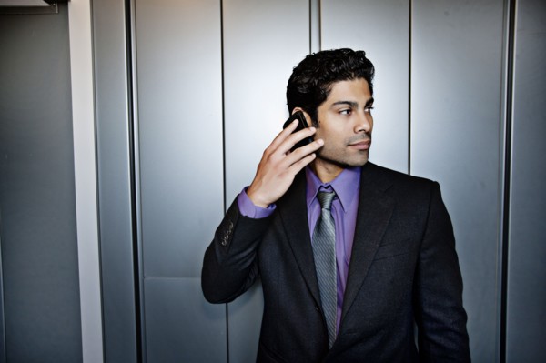 Hispanic businessman talking on cell phone