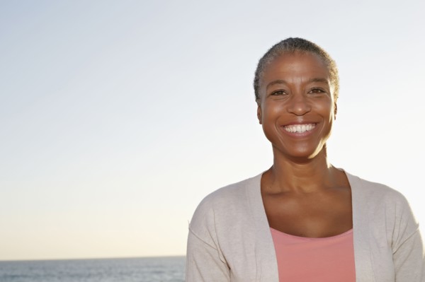 Black woman smiling outdoors