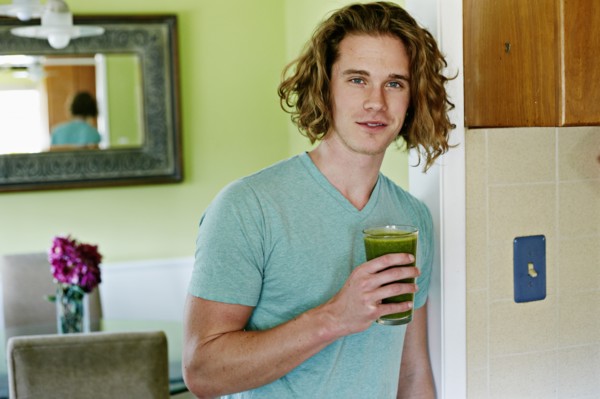 Caucasian man having glass of juice