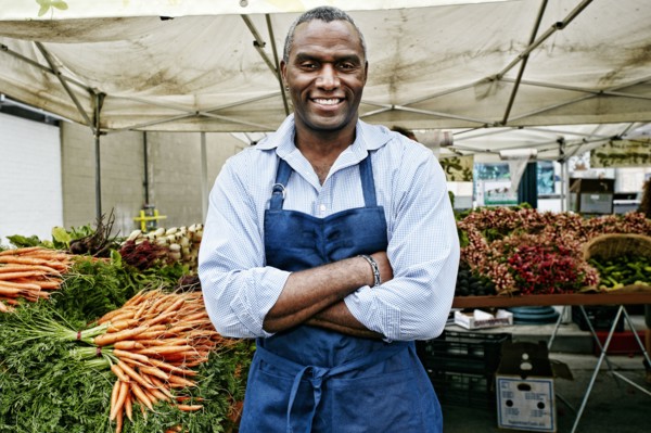 Black man working at outdoor market