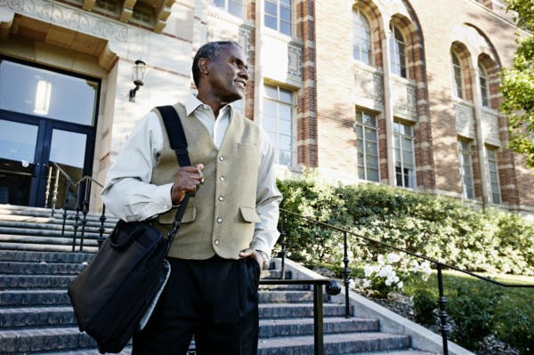 African American professor walking on campus