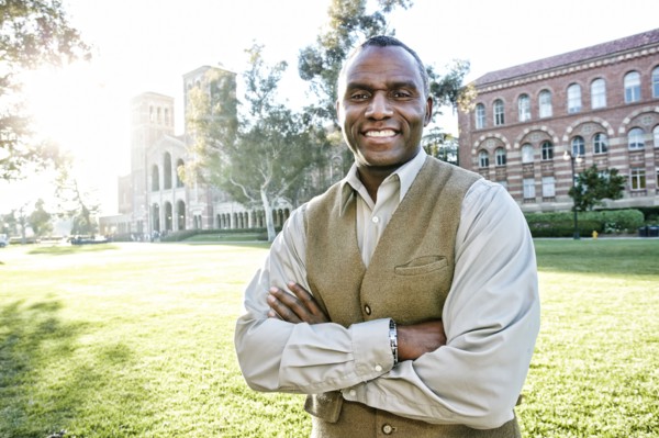 African American professor smiling on campus