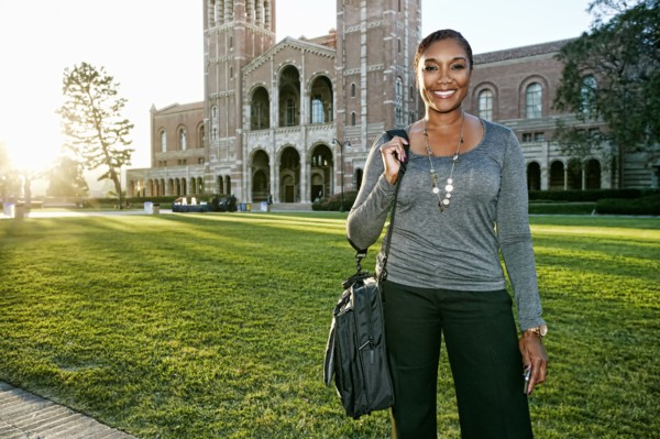 African American professor smiling on campus