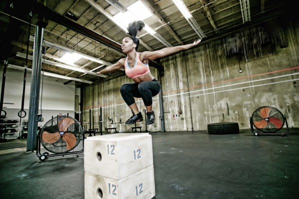 Mixed race woman exercising in gym