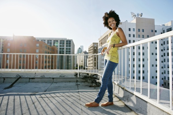 Mixed race woman on urban rooftop