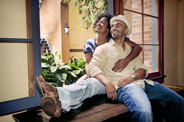 Couple relaxing together in windowsill