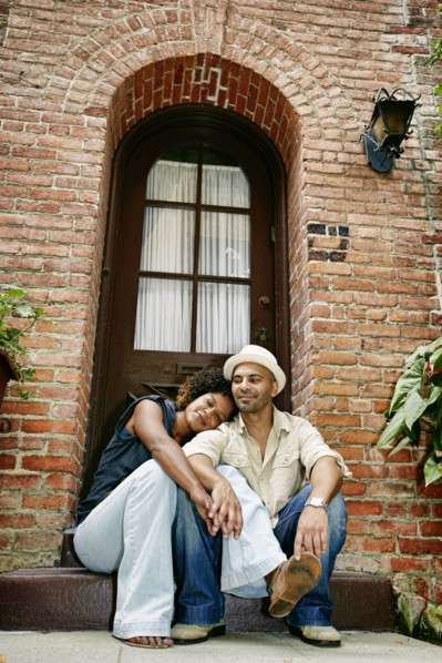 Couple smiling together on front stoop