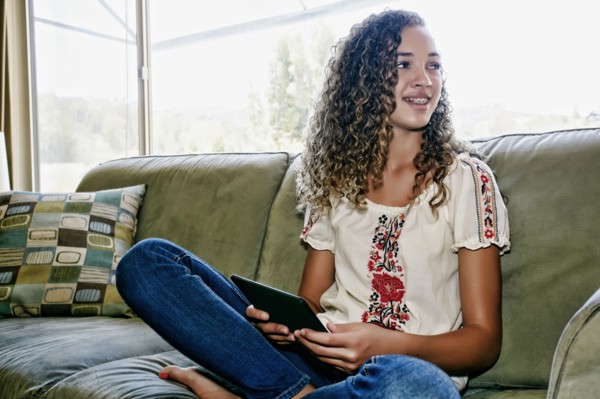Mixed race girl using digital tablet