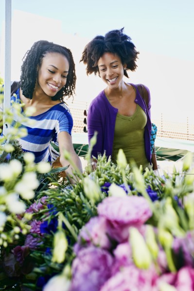 Women shopping together at flower market