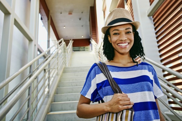 Black woman walking down steps