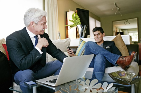 Businessmen talking in living room