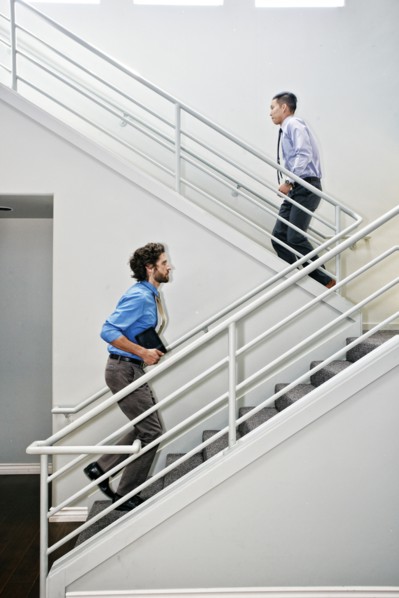 Businessmen climbing staircase