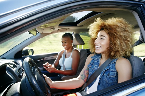 Daughter driving mother in car