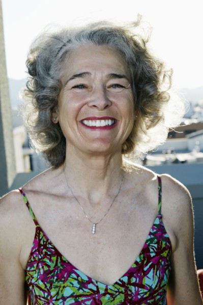 Caucasian woman smiling on urban rooftop