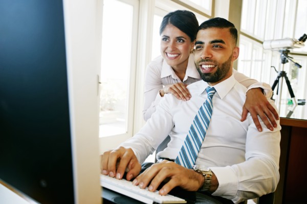 Business people working at computer in office
