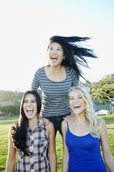 Women playing in field outdoors
