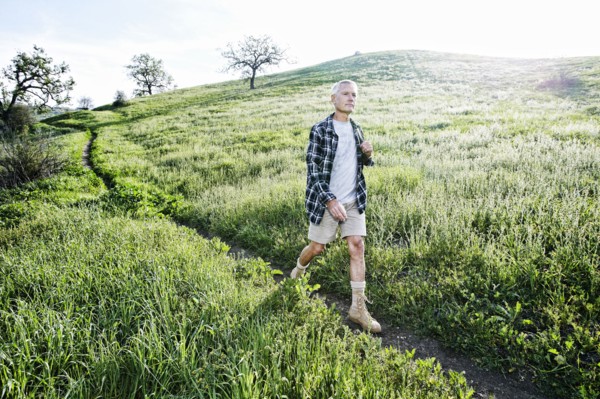 Older Caucasian man walking on dirt path