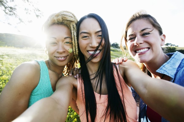 Friends taking selfie outdoors