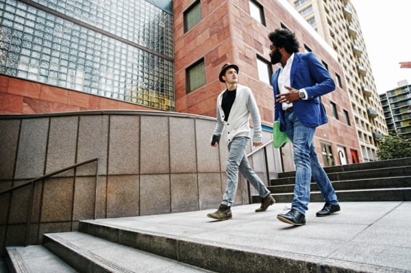 Businessmen talking on steps