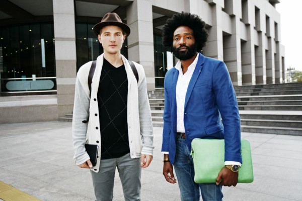 Businessmen standing in courtyard