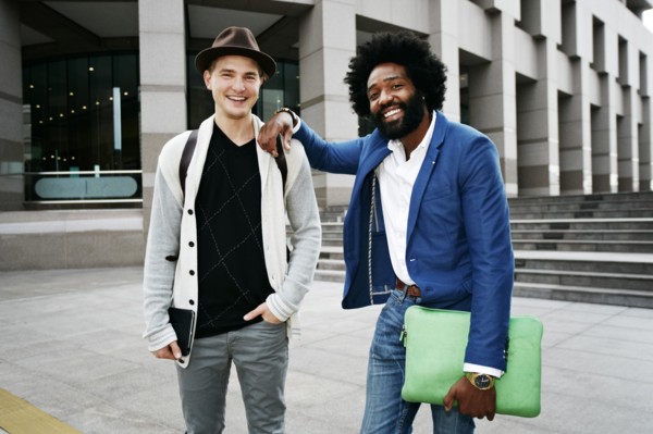 Businessmen smiling in courtyard