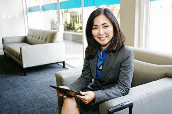 Japanese businesswoman using digital tablet in office