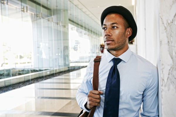Black businessman standing in office lobby