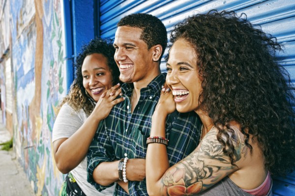 Friends smiling at garage door