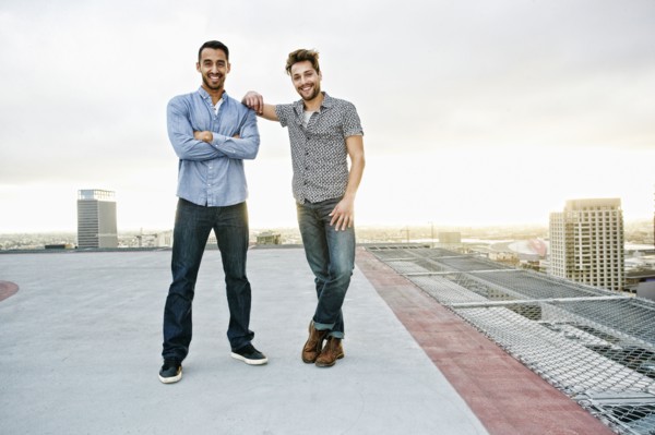 Stylish men posing on urban rooftop