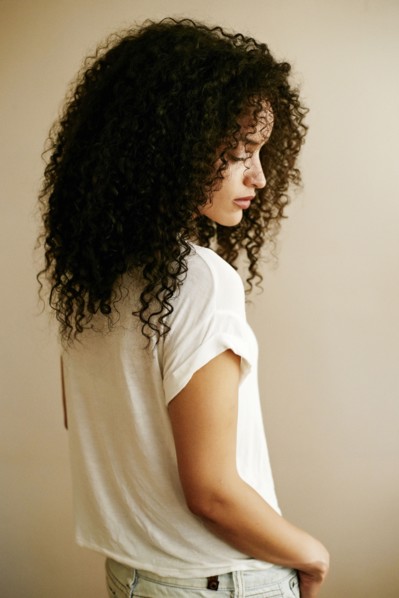 Pensive Hispanic woman looking down