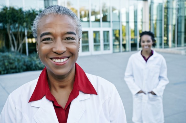 Portrait of smiling doctor outdoors at hospital