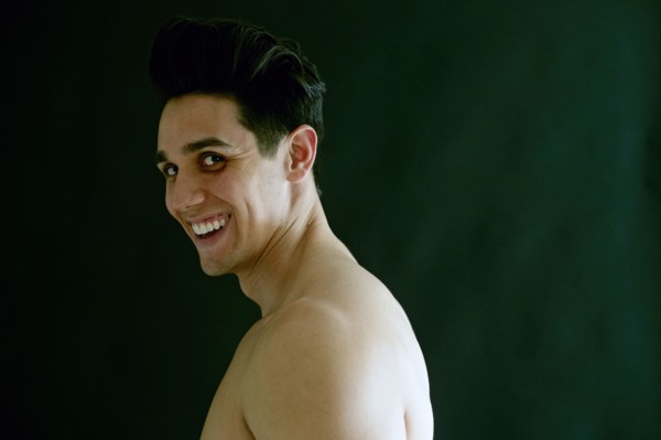 Portrait of naked Caucasian man laughing