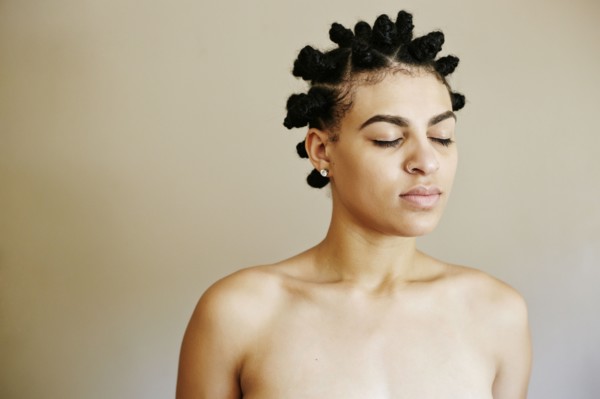 Portrait of Mixed Race woman with eyes closed