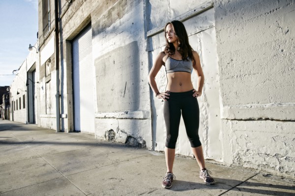 Mixed race woman standing on sidewalk