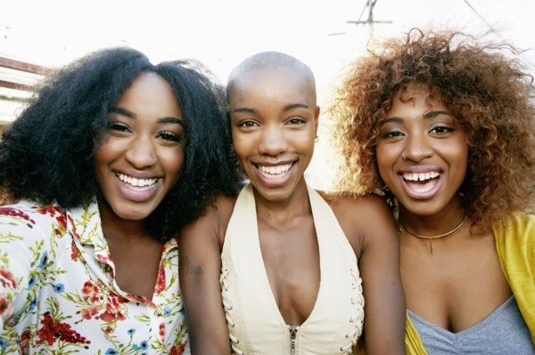 Portrait of women smiling outdoors