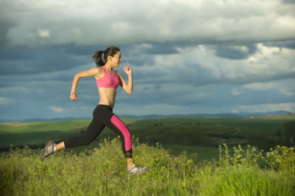 Japanese woman running in field