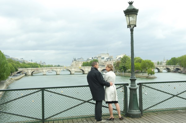 Caucasian couple talking on bridge