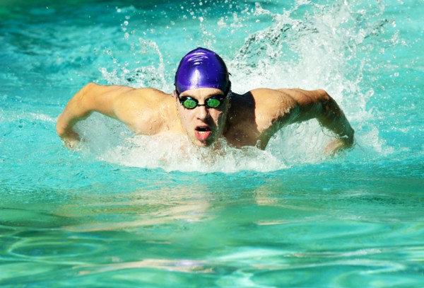 Caucasian swimmer training in swimming pool