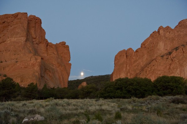 Red cliffs rising in rural landscape