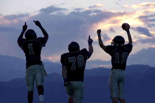 Football players cheering in game
