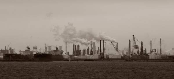 Smoke billowing from distant factory