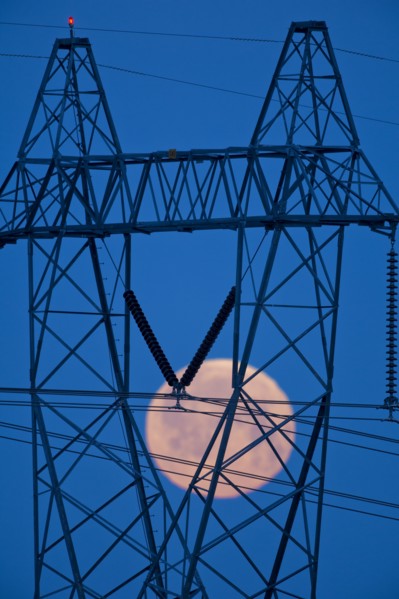 Moon viewed through power lines