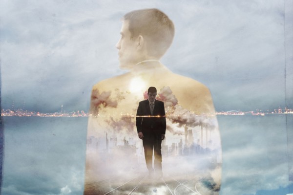 Double exposure of businessman and urban coastline