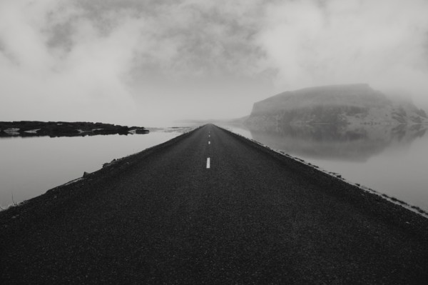 Paved road over still water