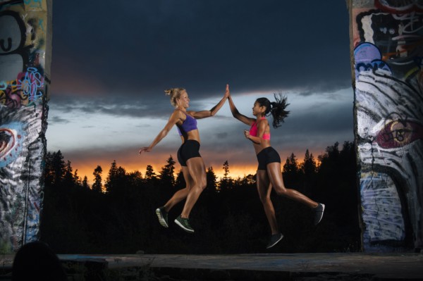 Runners jumping and high-fiving