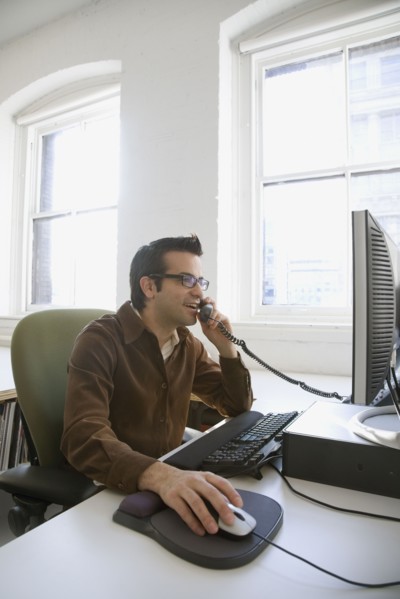 Hispanic businessman talking on telephone
